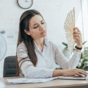 business woman holding fan
