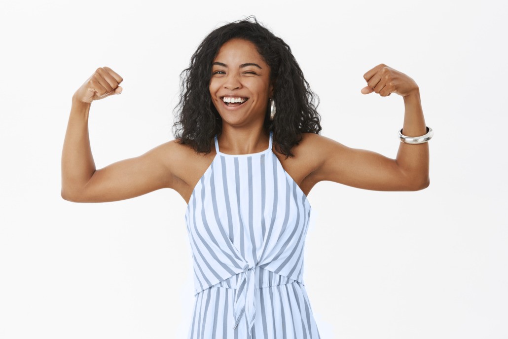 entrepreneur woman holding up arms to reflect strength