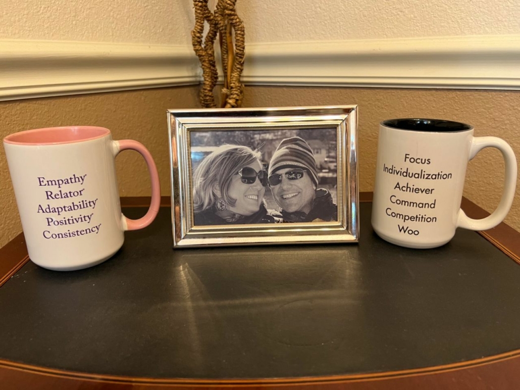 Decorative featured image for Brent's blog Celebrating 39 Years of Love and Strengths: A Tribute to Rhonda. Features a framed picture of the couple with their respective top 5 Strengths coffee mugs on either side.